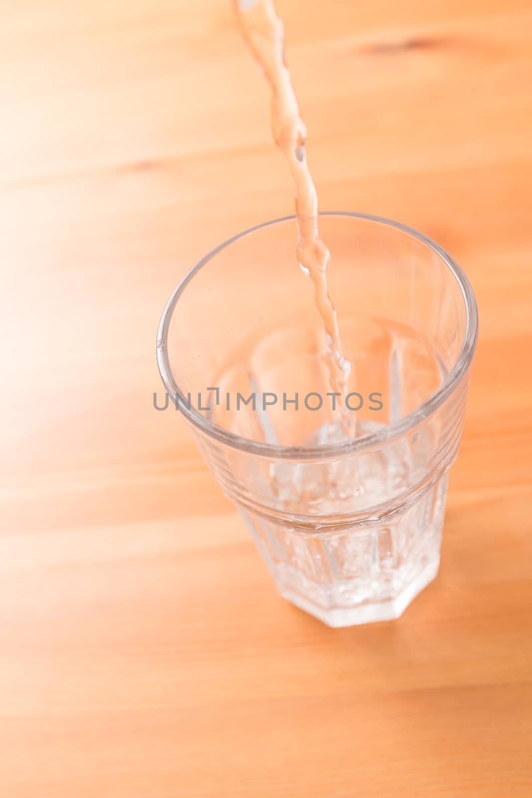 Pouring water to glass