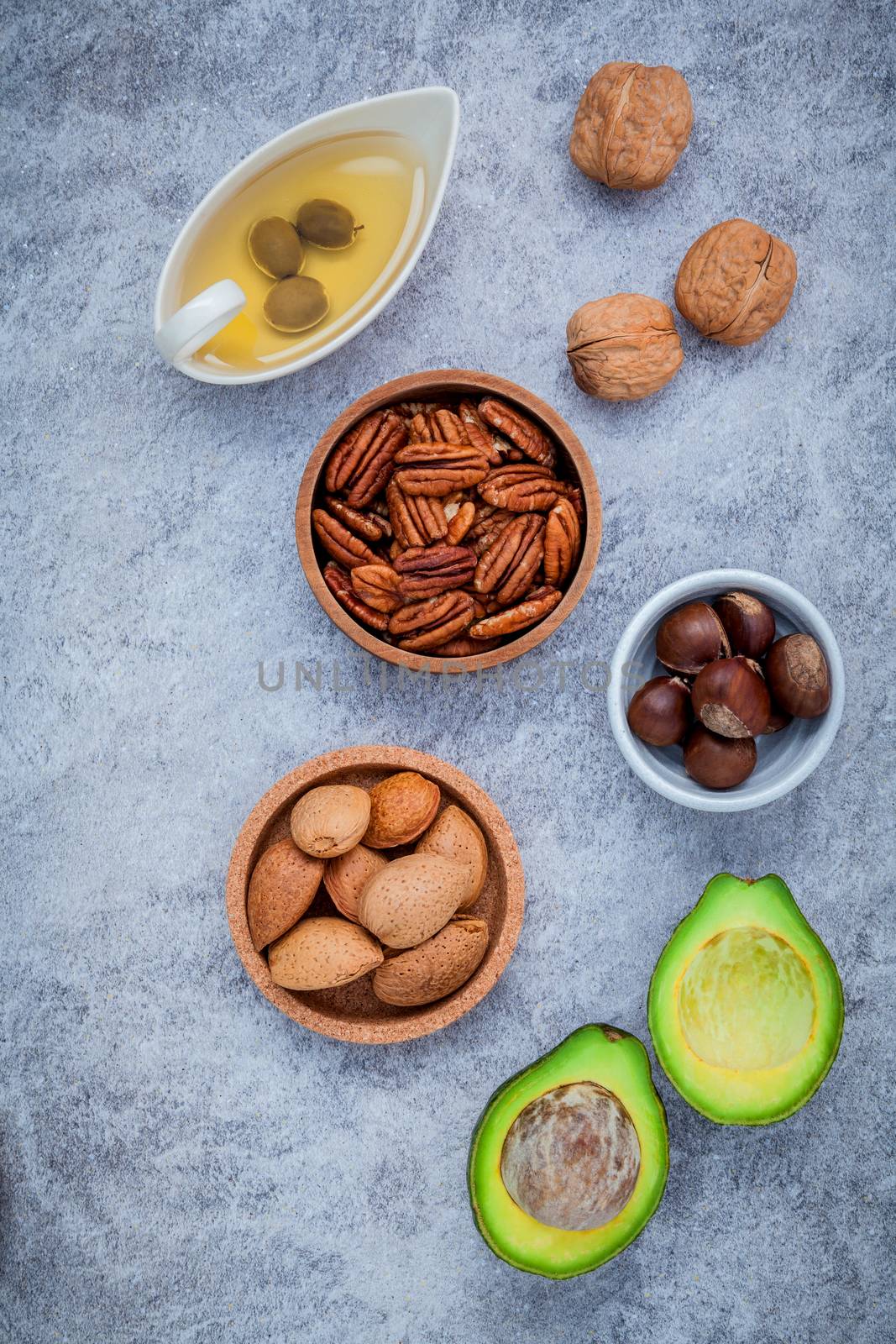 Selection food sources of omega 3 and unsaturated fats. super food high omega 3 and unsaturated fats for healthy food. Almond ,pecan ,hazelnuts,walnuts ,olive oil and avocado.