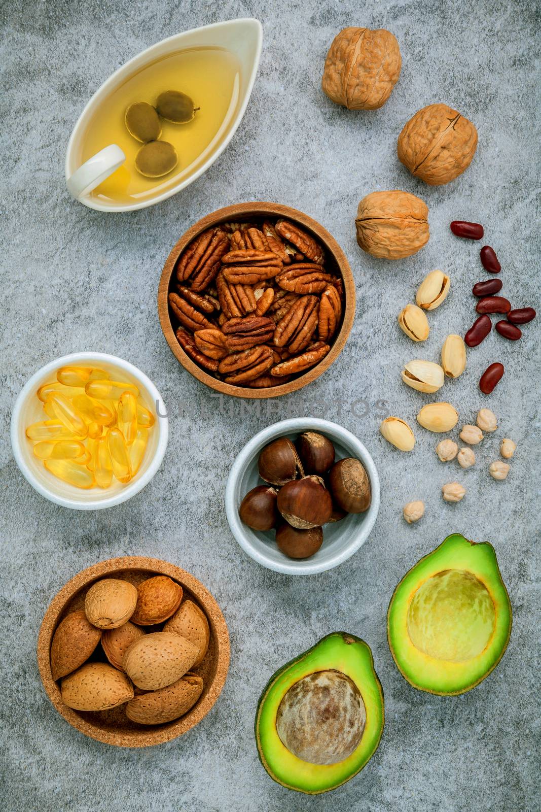 Selection food sources of omega 3 and unsaturated fats. super food high omega 3 and unsaturated fats for healthy food. Almond ,pecan ,hazelnuts,walnuts ,olive oil ,fish oil and avocado .