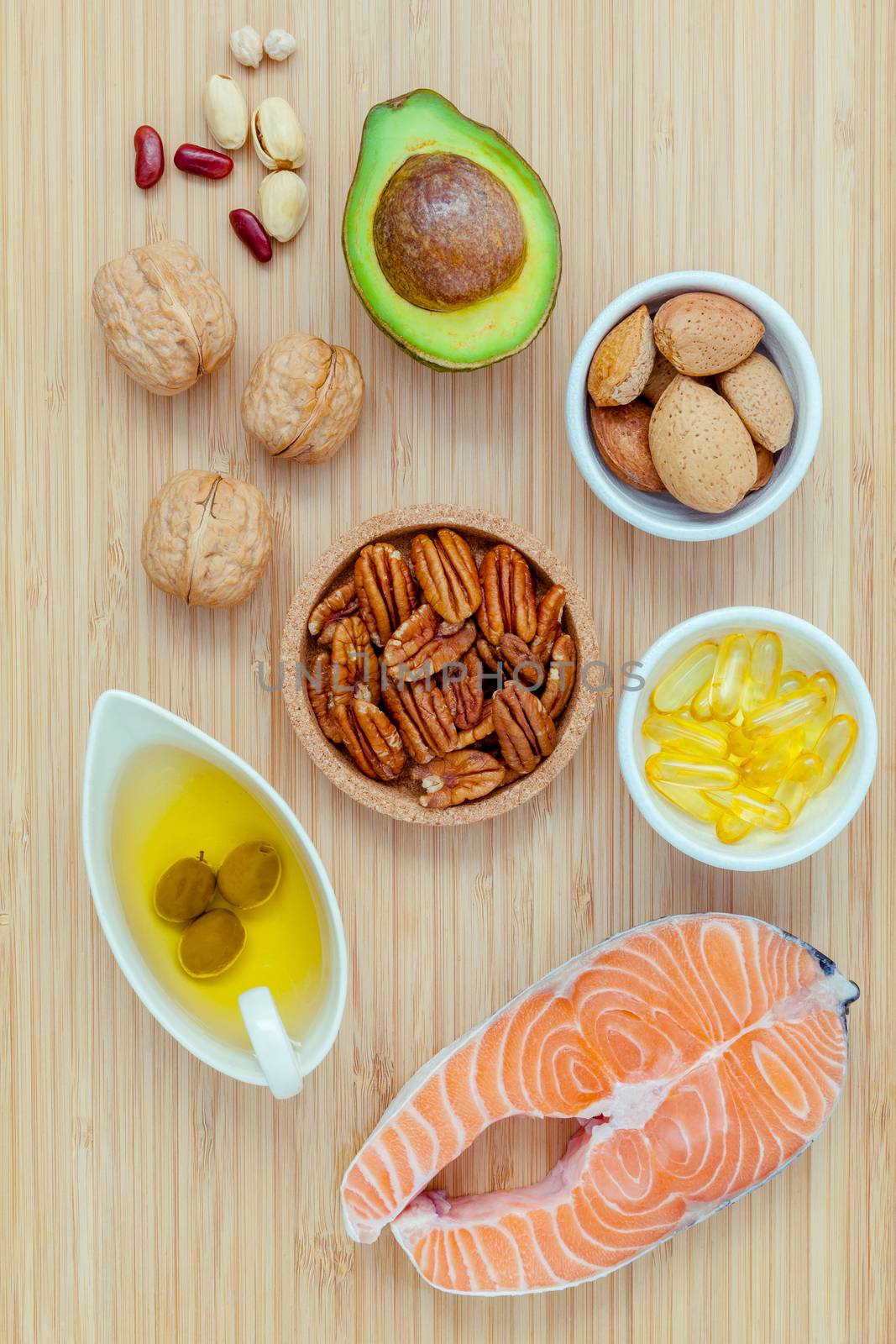 Selection food sources of omega 3 and unsaturated fats. super food high omega 3 and unsaturated fats for healthy food. Almond ,pecan ,hazelnuts,walnuts ,olive oil ,fish oil and avocado .