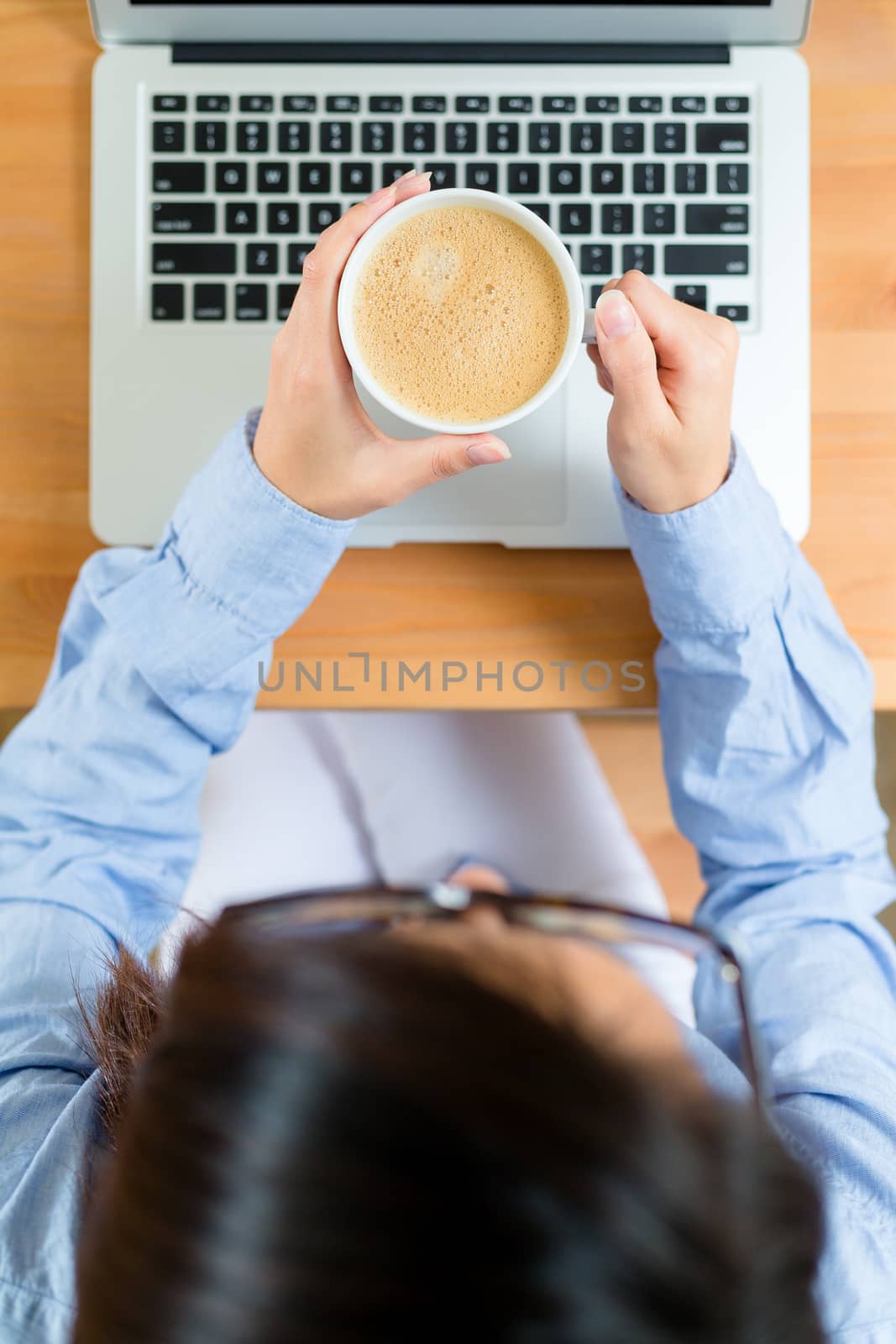 Top view of woman use of notebook computer