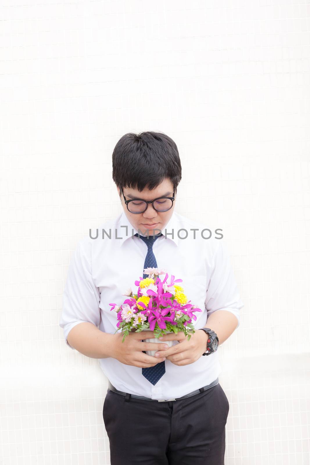 Waiting for his girlfriend. Close up of handsome young man holdi by nopparats