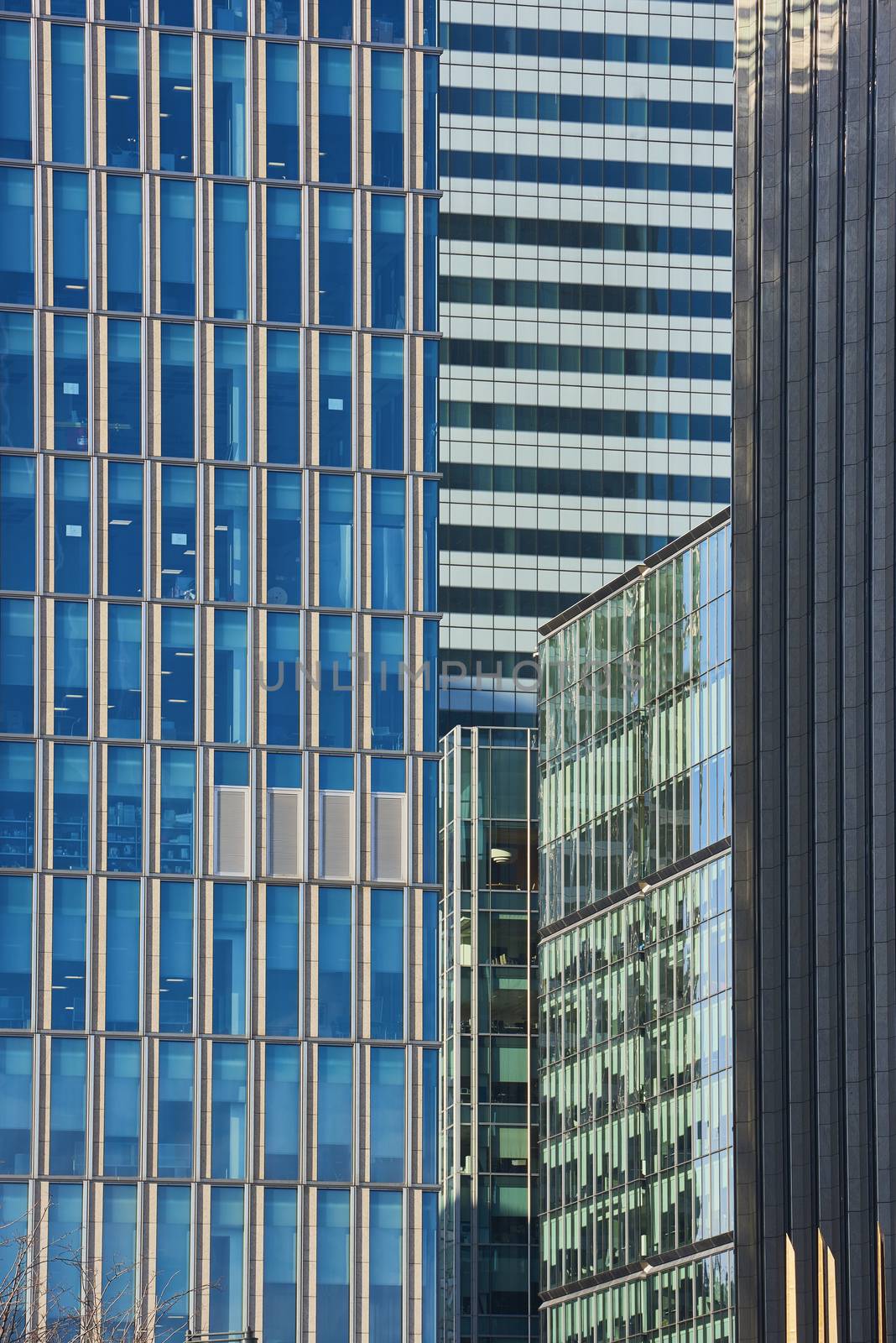 Close up cropped shot of skyscraper window frames in blue metal.
