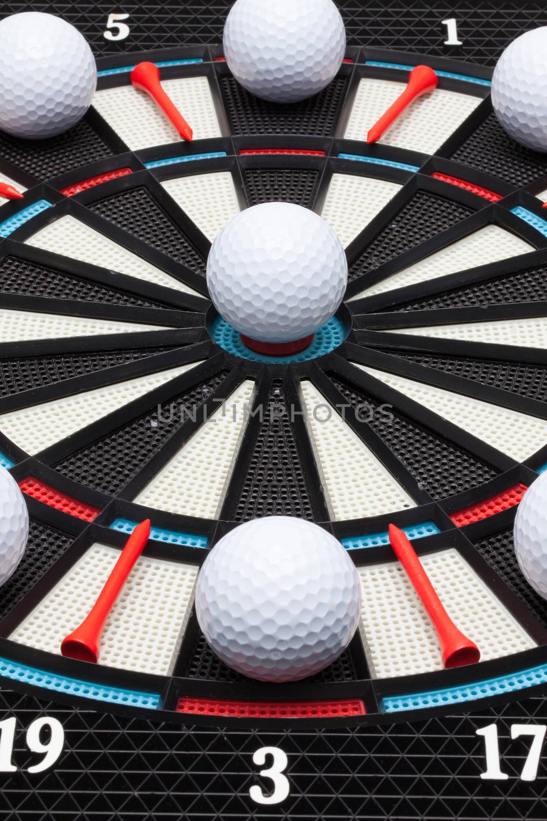 Detail dartboard with white golf balls