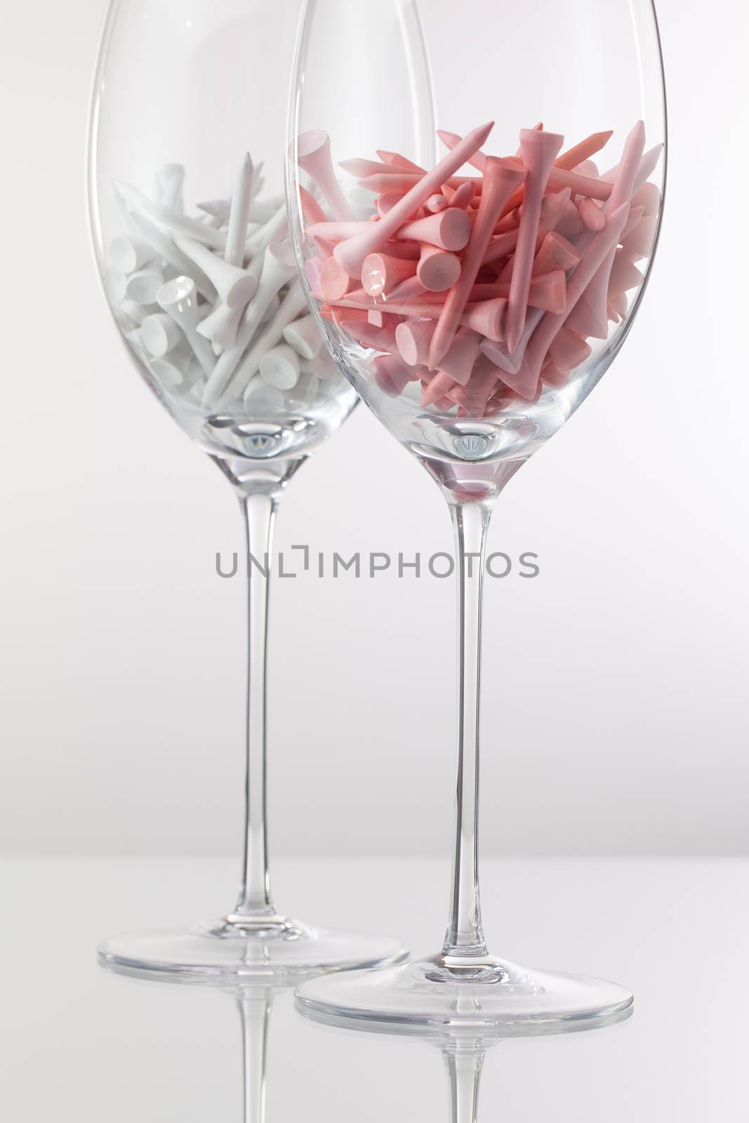 Two glasses of wine and golf equipments  by CaptureLight