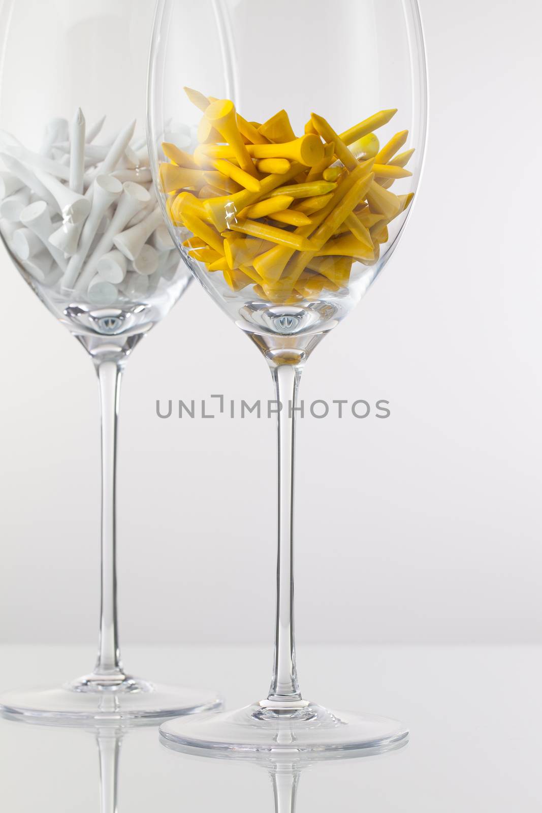 Two glasses of wine and golf equipments  by CaptureLight