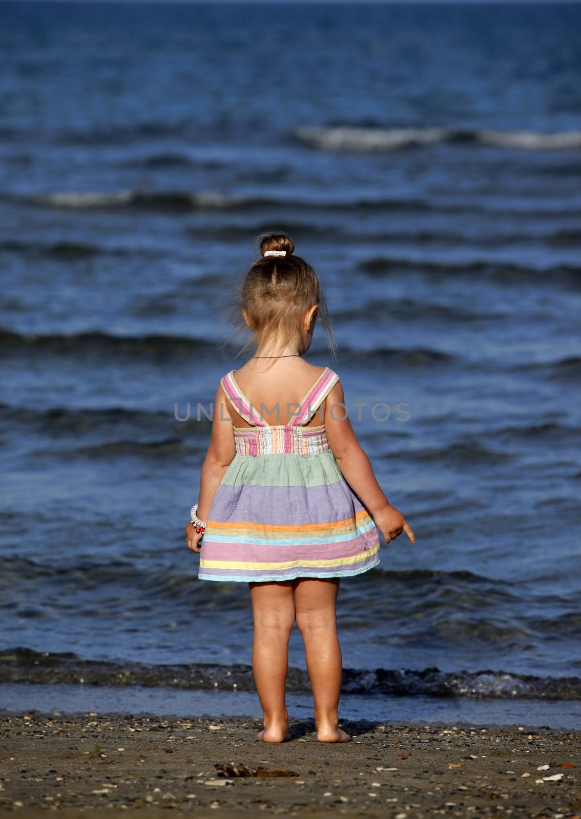 Small girl on the beach in Larnaka, Cyprus