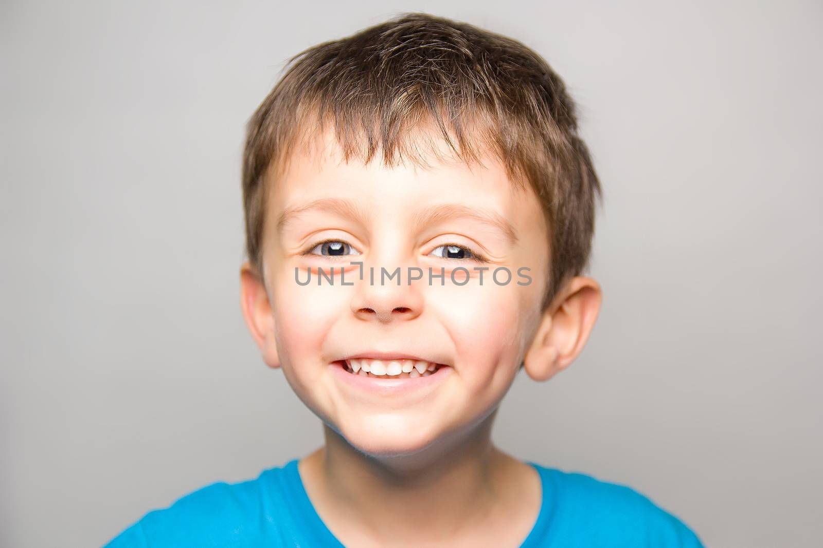 Child in joy smilling at camera