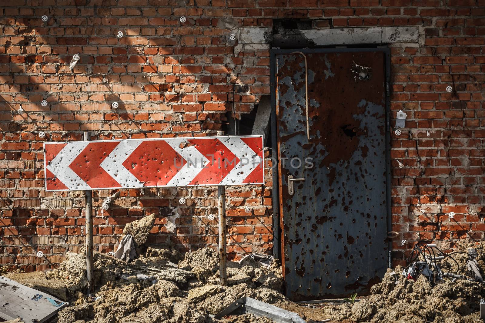 Flecked with shrapnel brick wall, door and sign by mrakor