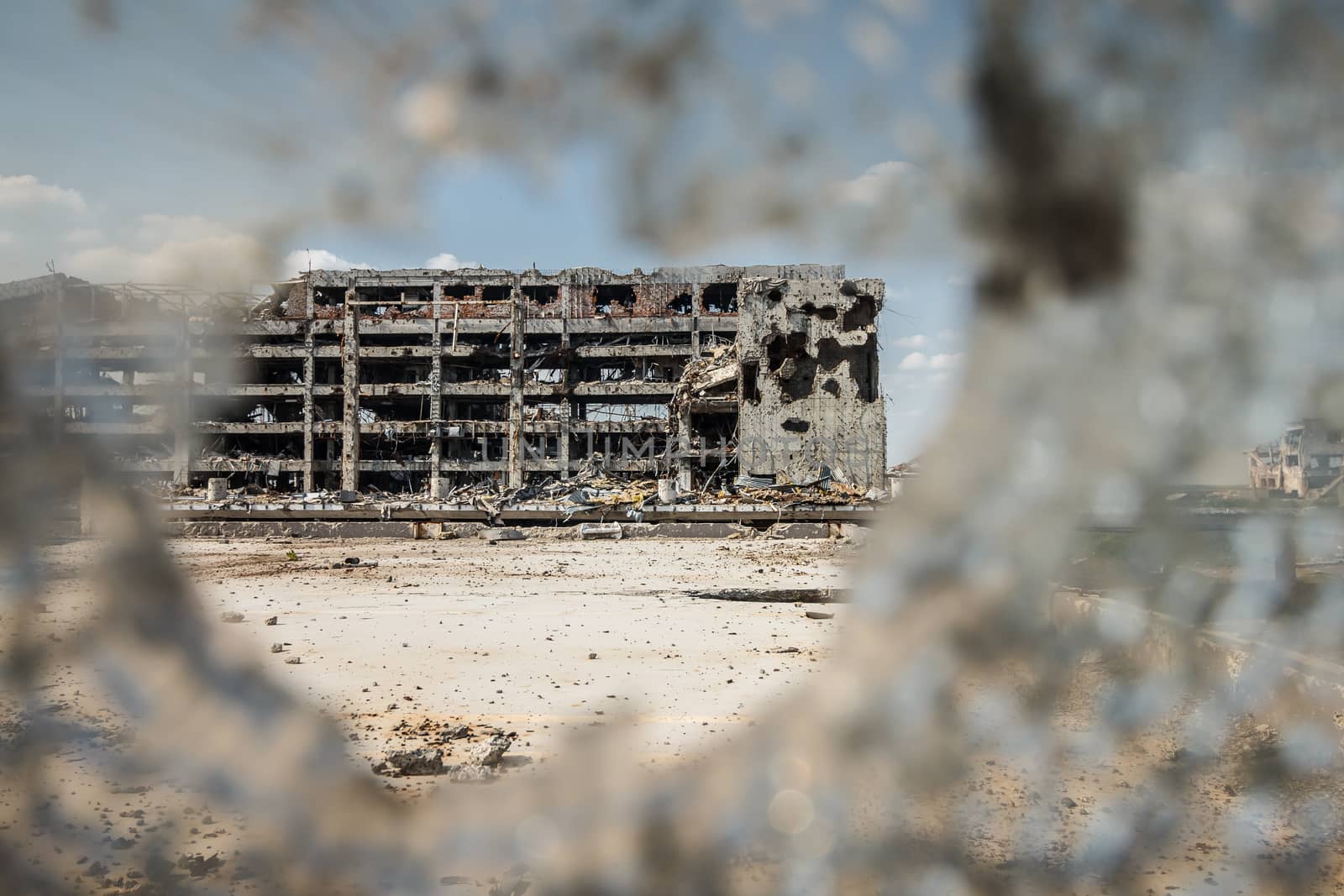 Wide Angle view of donetsk airport ruins through broken glass after massive artillery shelling