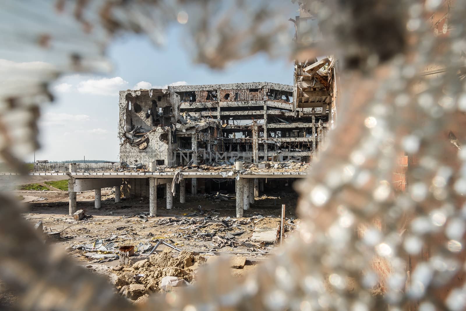 Wide Angle view of donetsk airport ruins through broken glass after massive artillery shelling