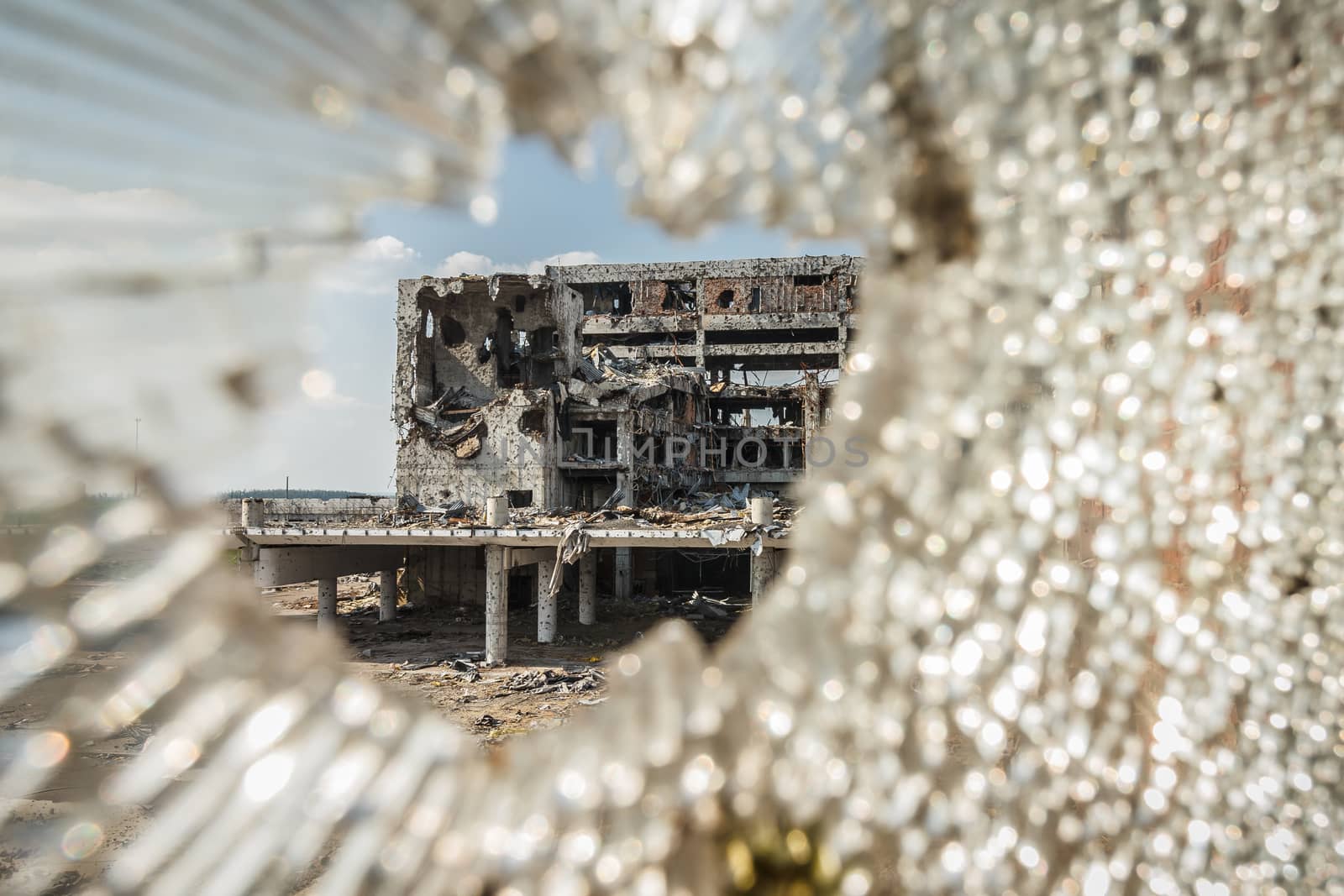 Wide Angle view of donetsk airport ruins through broken glass after massive artillery shelling