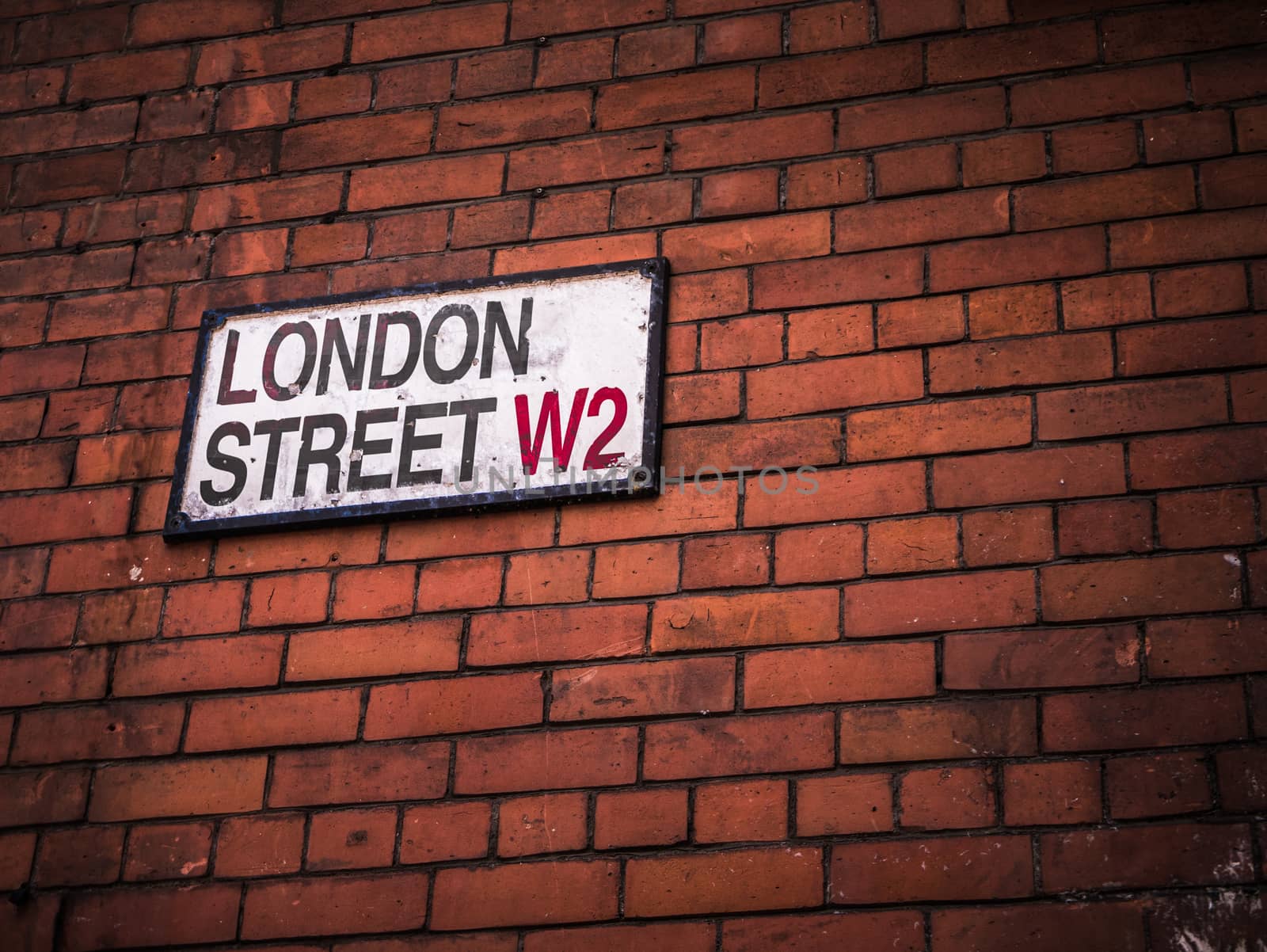 London Street Sign On A Red Brick Wall