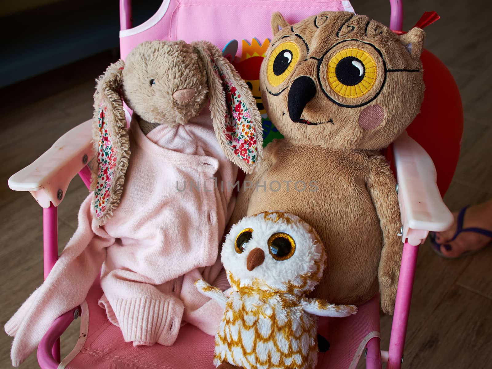 Soft stuffed animal toys in a child's bedroom by Ronyzmbow