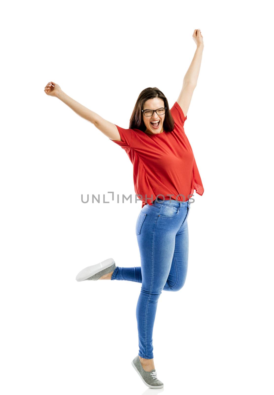 Lovely happy woman jumping of joy 