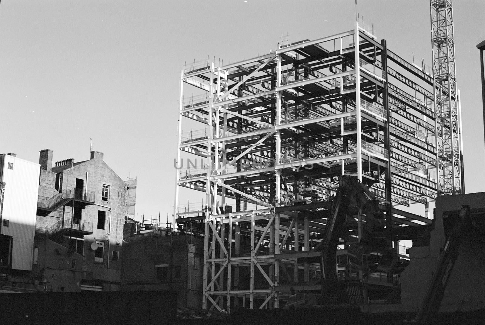 Black and white film image of a construction site