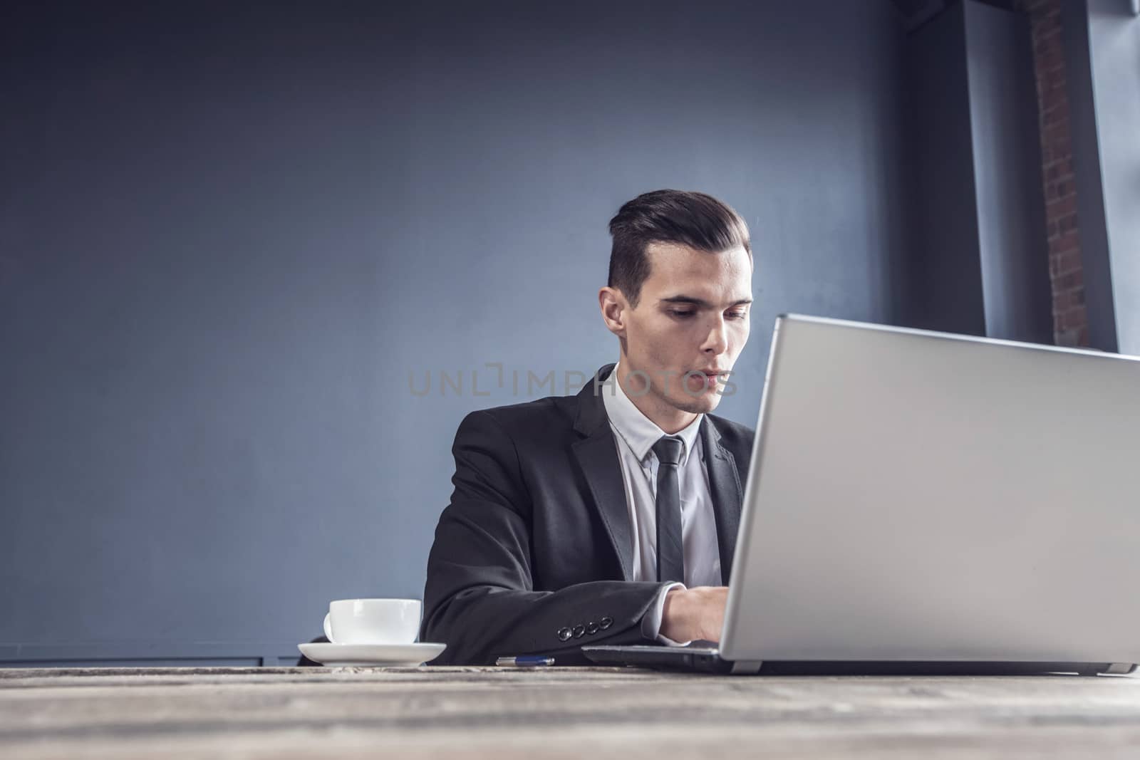 Business man working with laptop computer in office