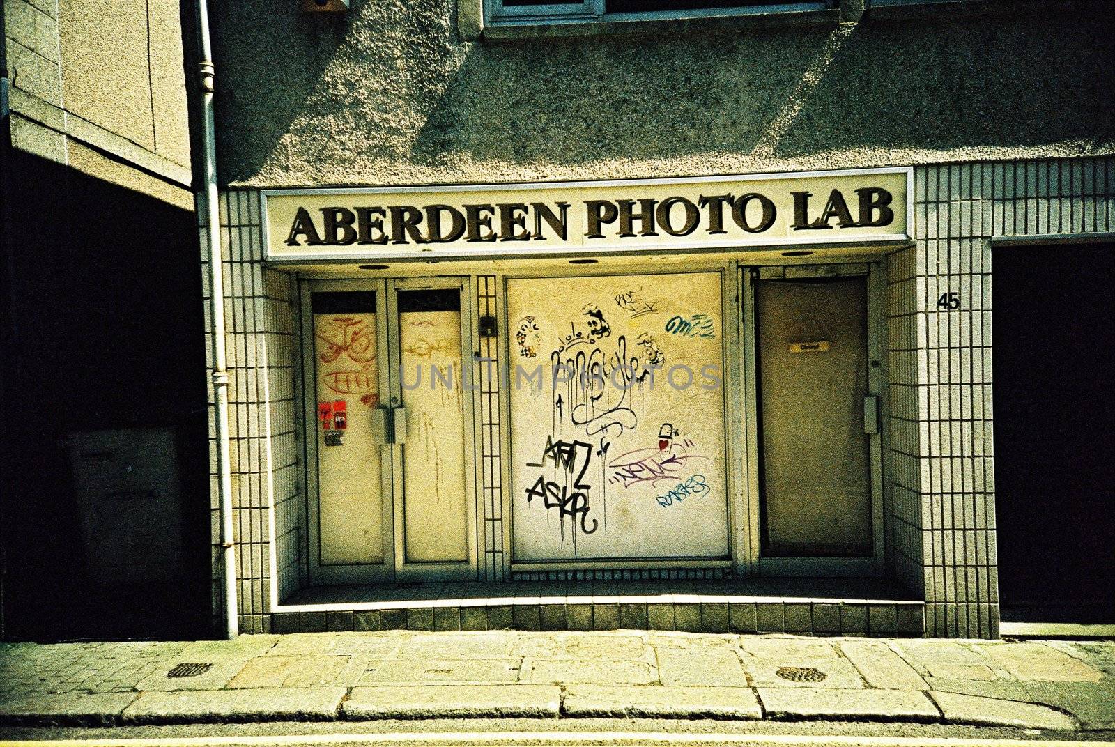 Aberdeen photo lab writen on the wall of a building in Aberdeen