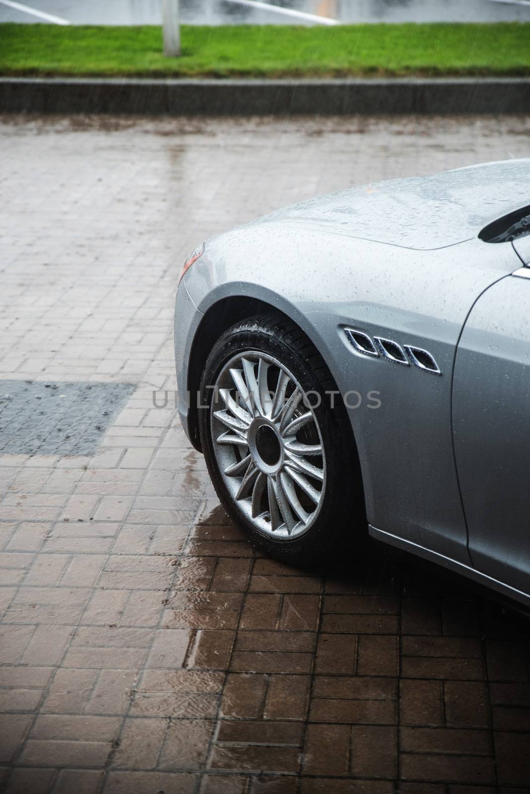 raindrops on modern car in rainy season
