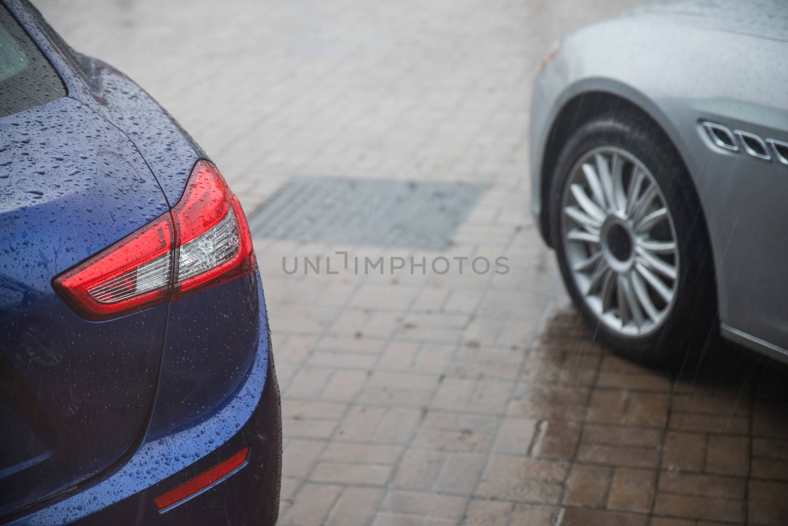 raindrops on modern car in rainy season