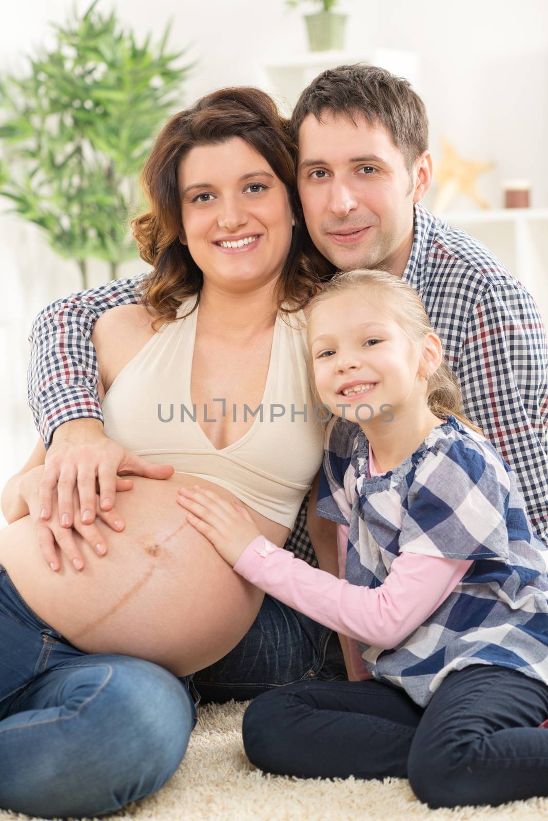 Happy Family Expecting A New Baby by MilanMarkovic78