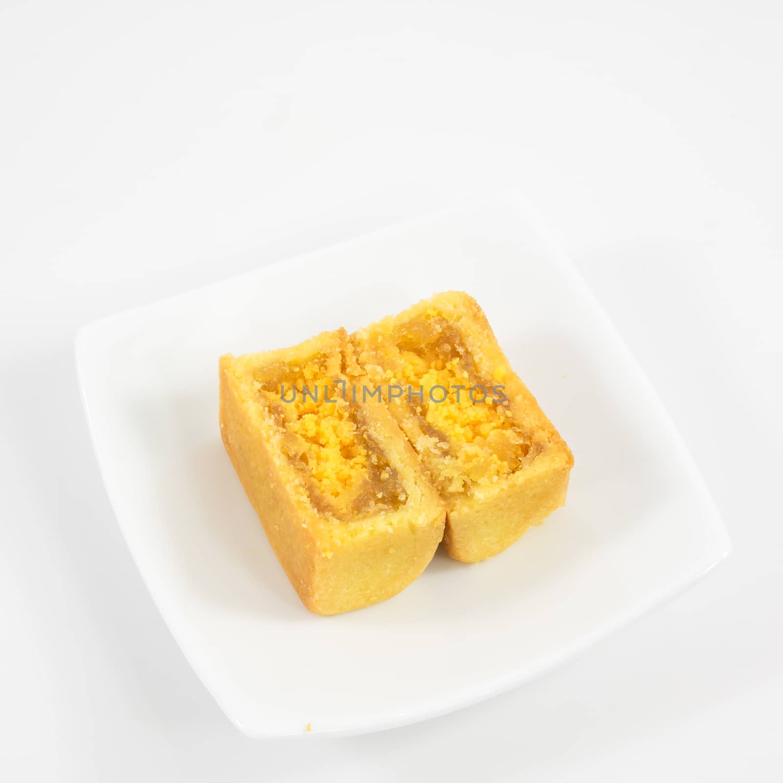 The tasty Taiwanese pineapple pastry cake on the small white square dish.