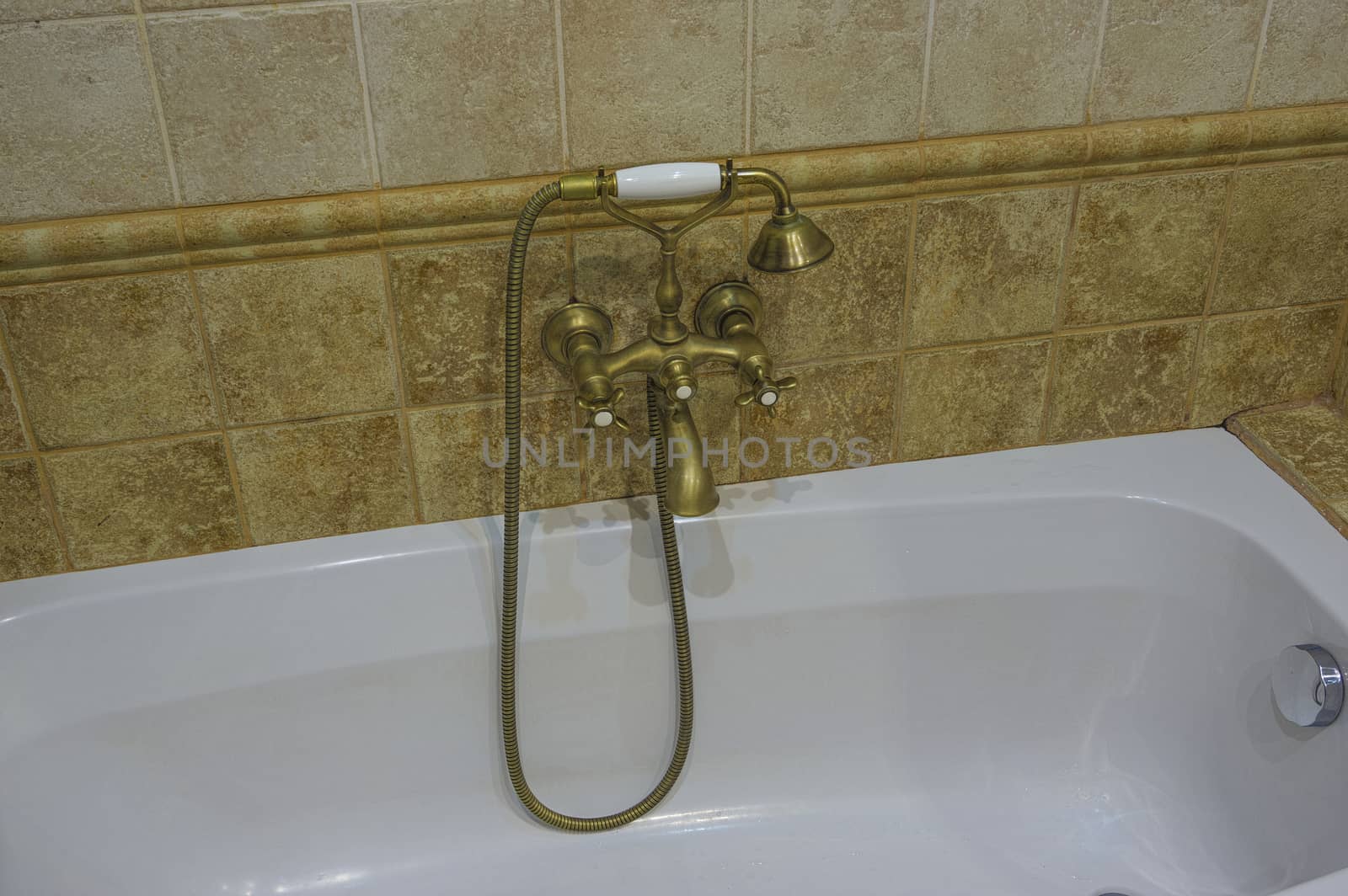 bathroom with shower and faucet made of brass in retro style