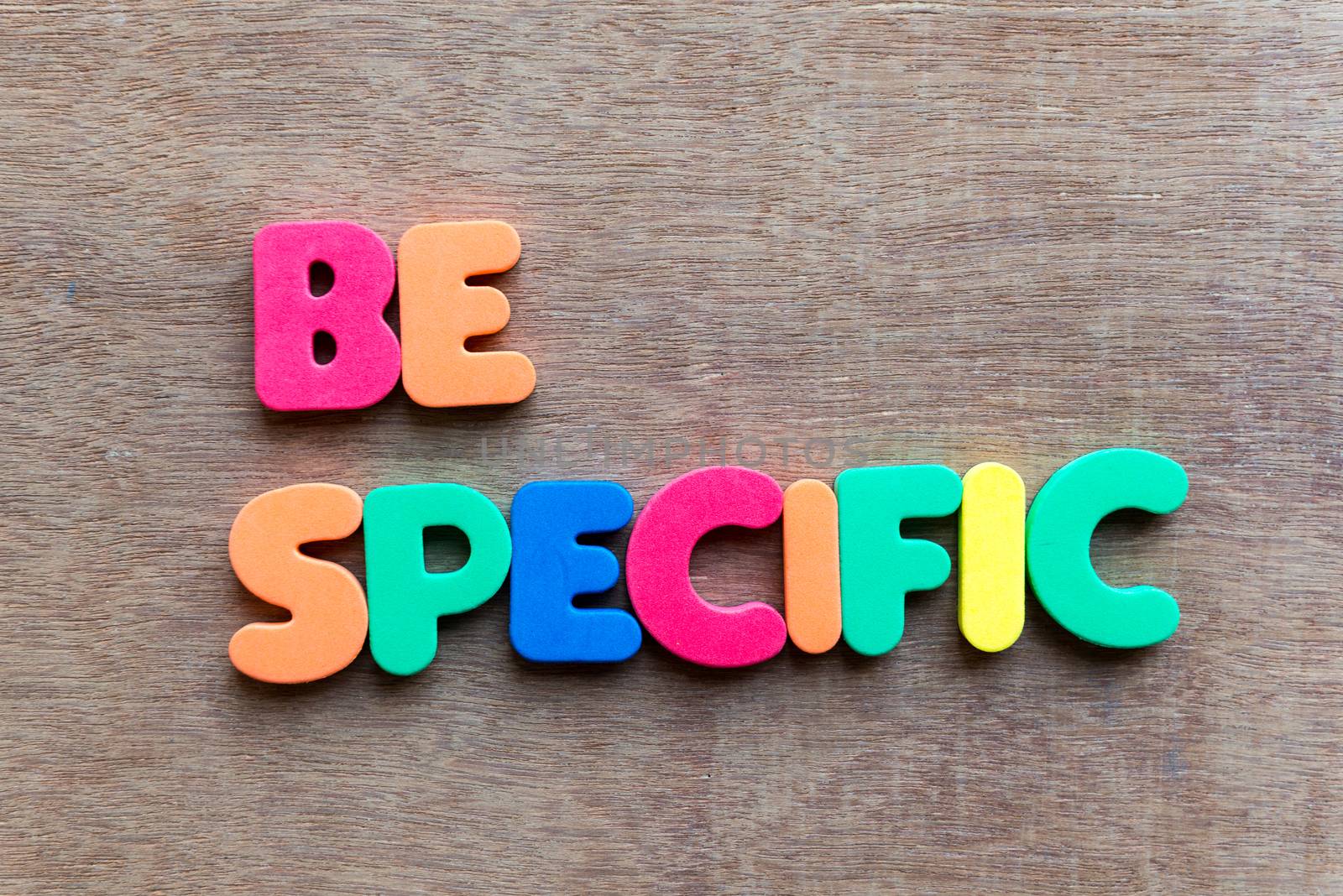 be specific colorful word in the wooden background
