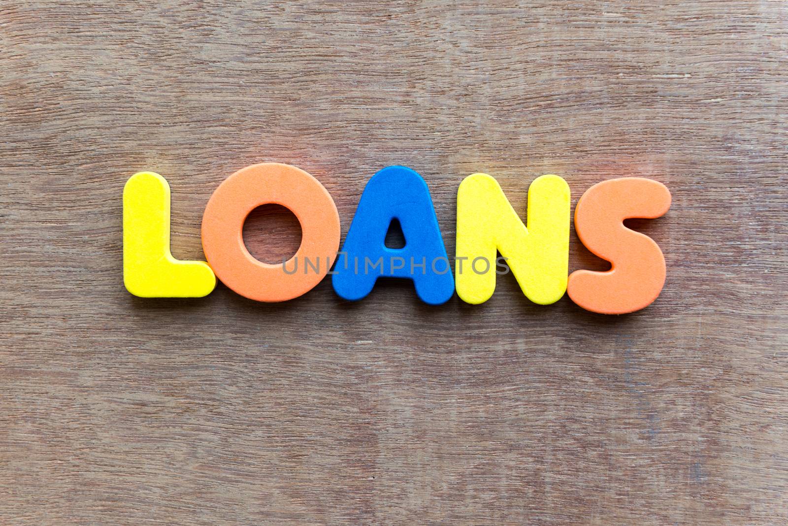 loans colorful word in the wooden background