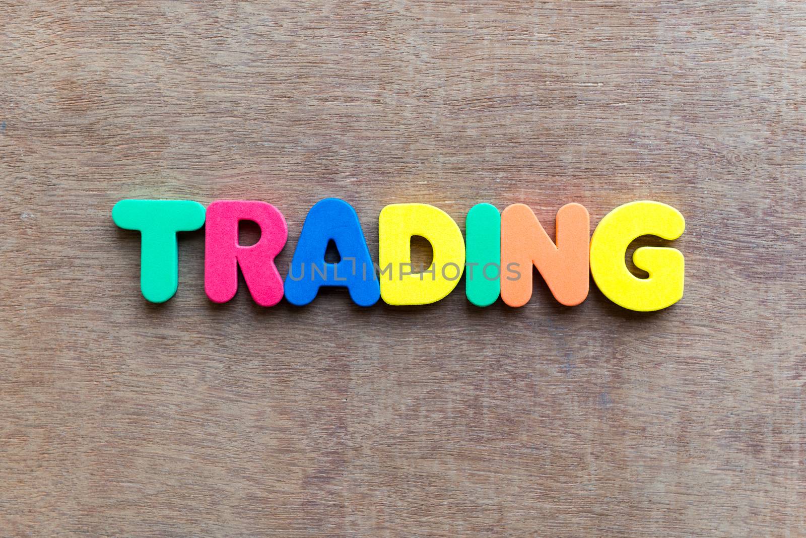 trading colorful word in the wooden background