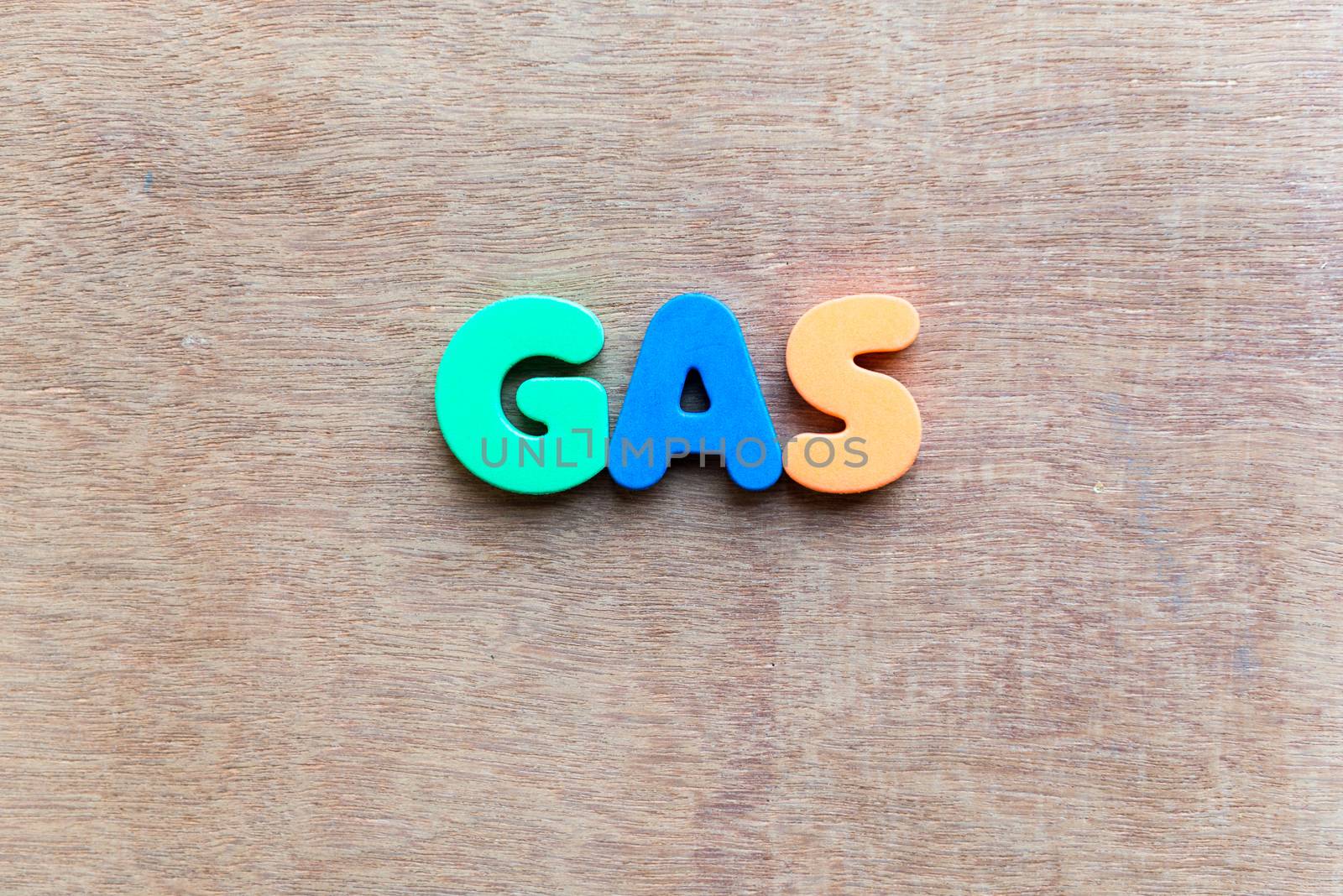 gas colorful word in the wooden background