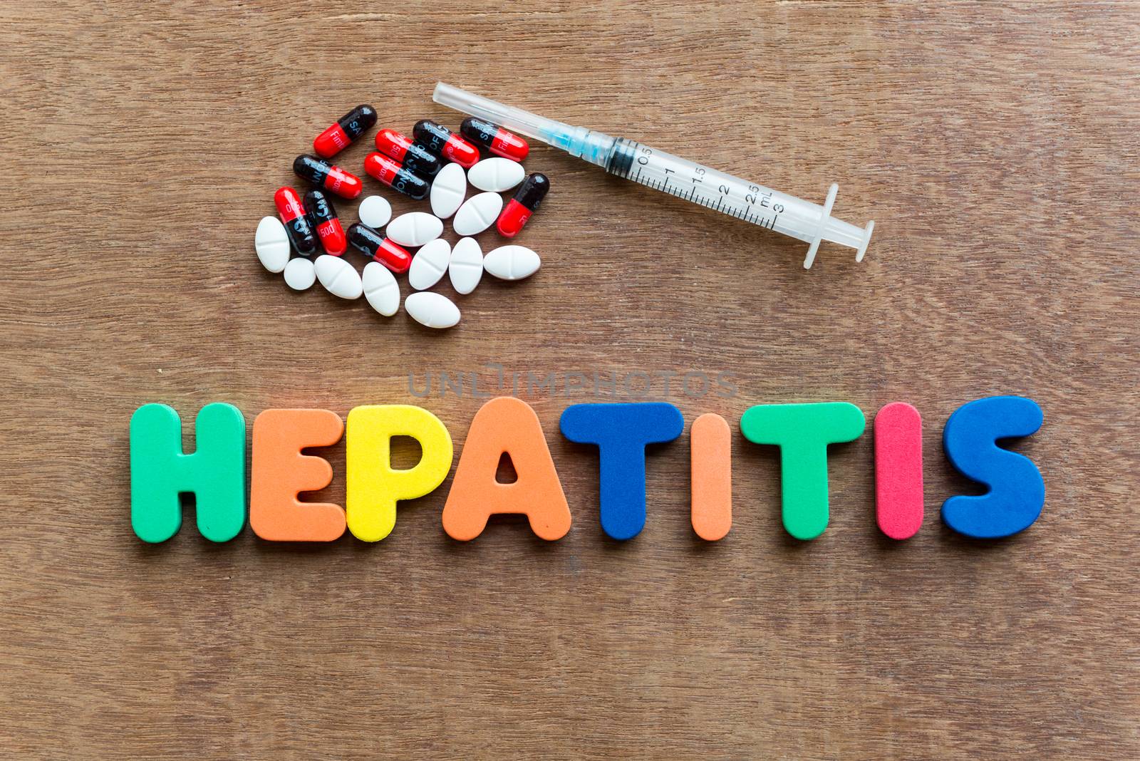 hepatitis colorful word in the wooden background