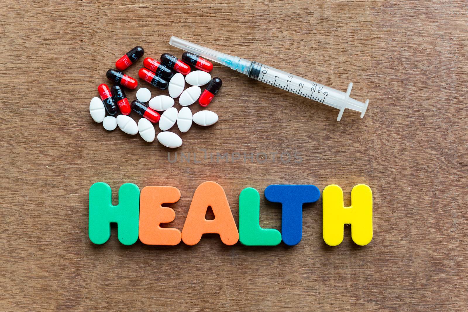 health colorful word in the wooden background