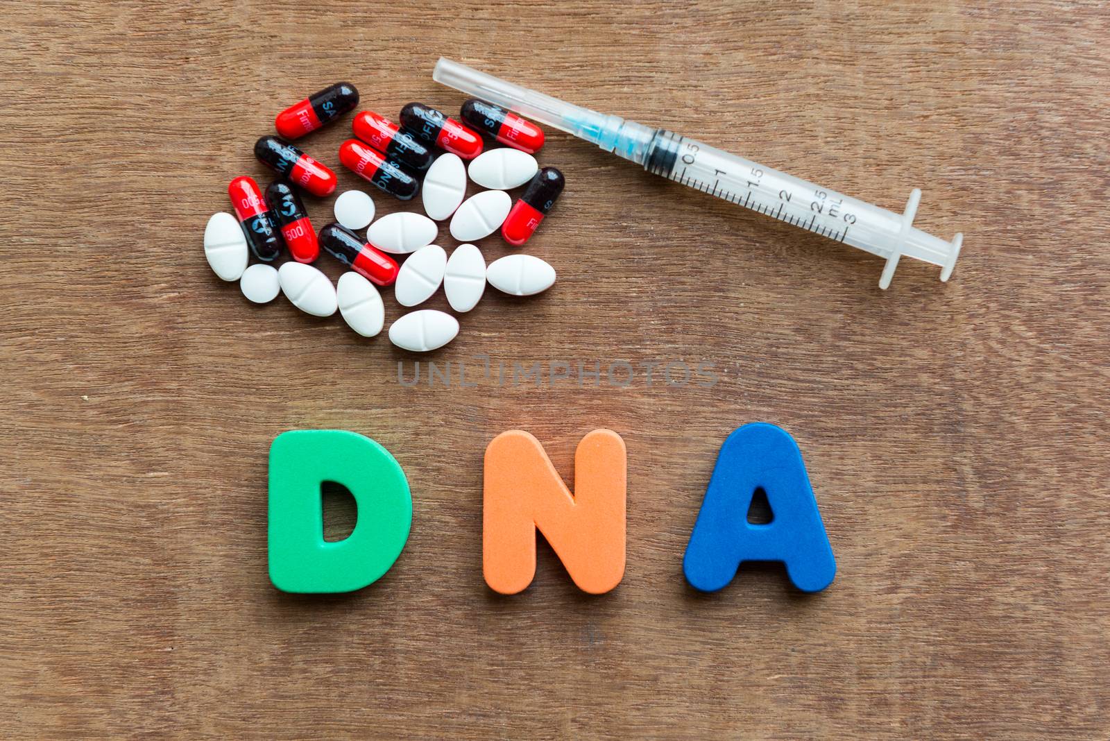 dna colorful word in the wooden background