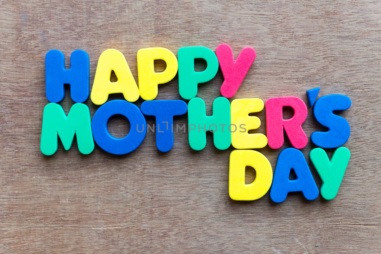 happy mother's day on wooden background