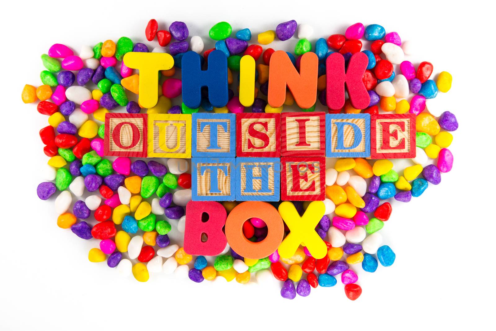 think outside the box word in colorful stone
