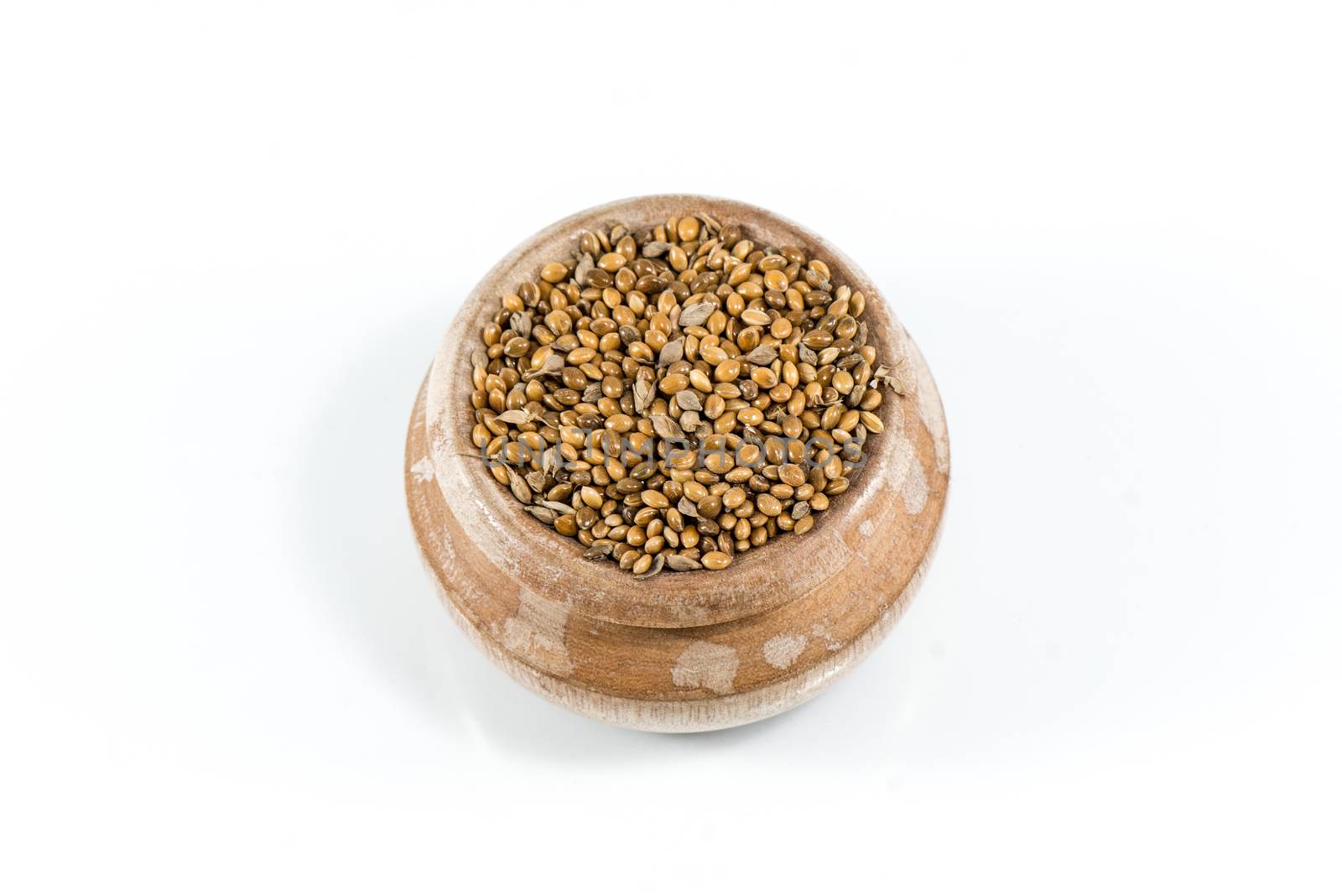 Hemp seeds held by woman hands, shaping a heart