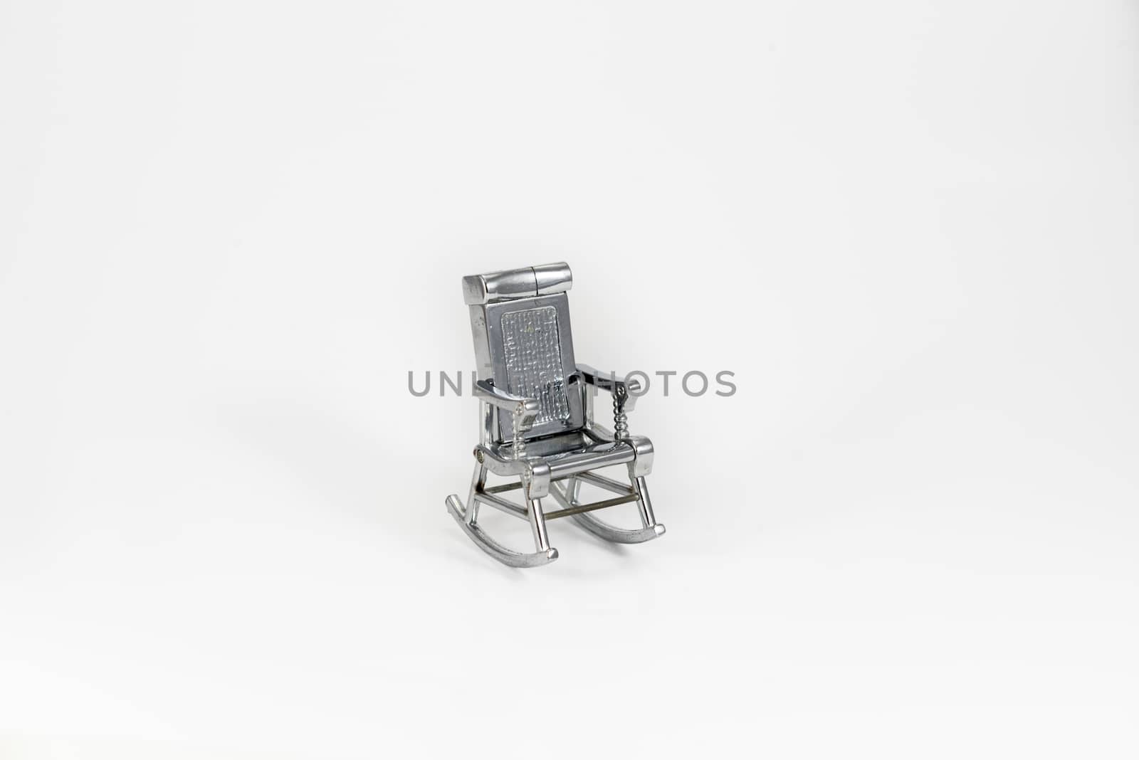 grey toy chair on the white background