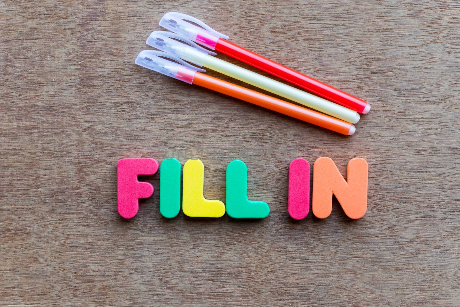 fill in colorful word on the wooden background