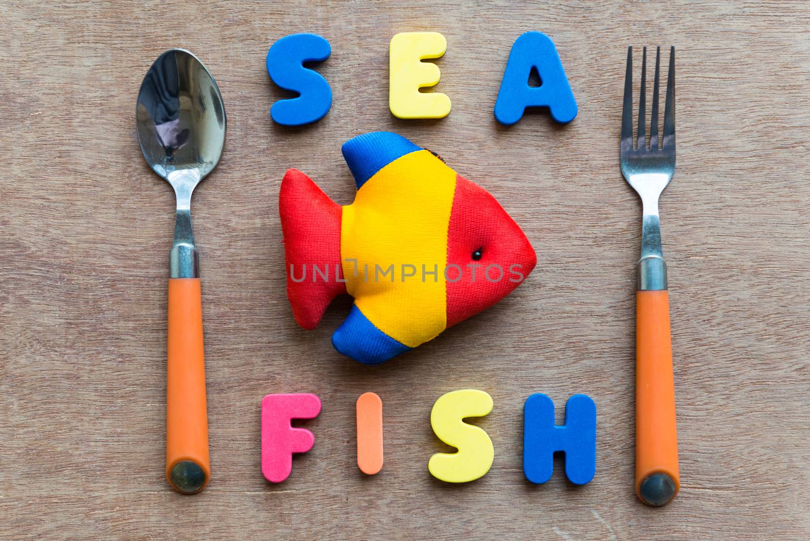 sea fish colorful word on the wooden background