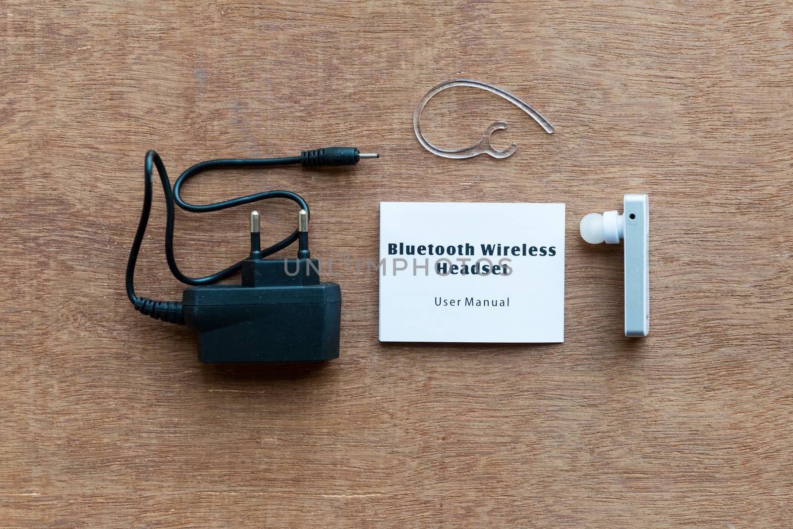 bluetooth device with charger on wooden background