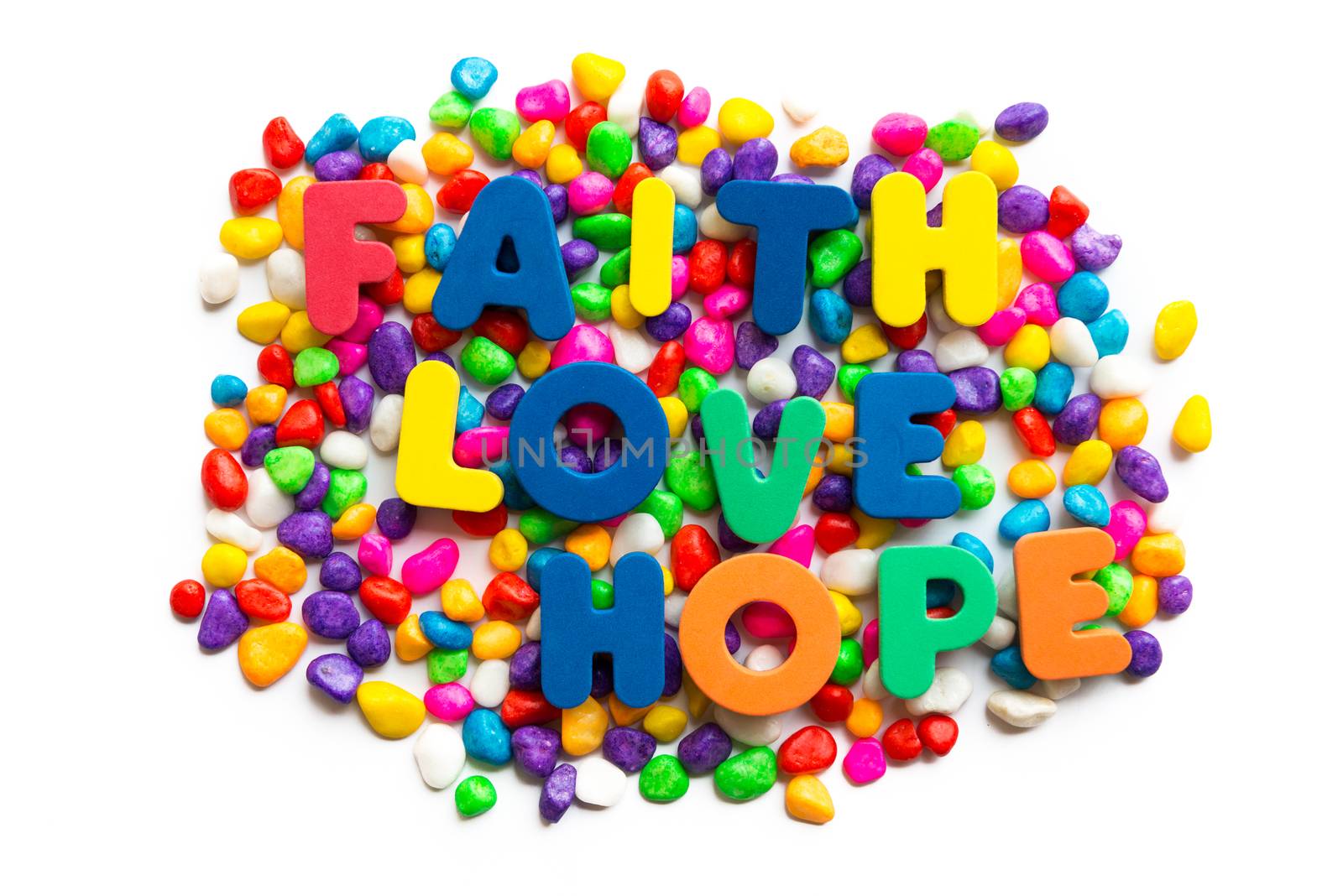 faith love hope words on the colorful stone and white background