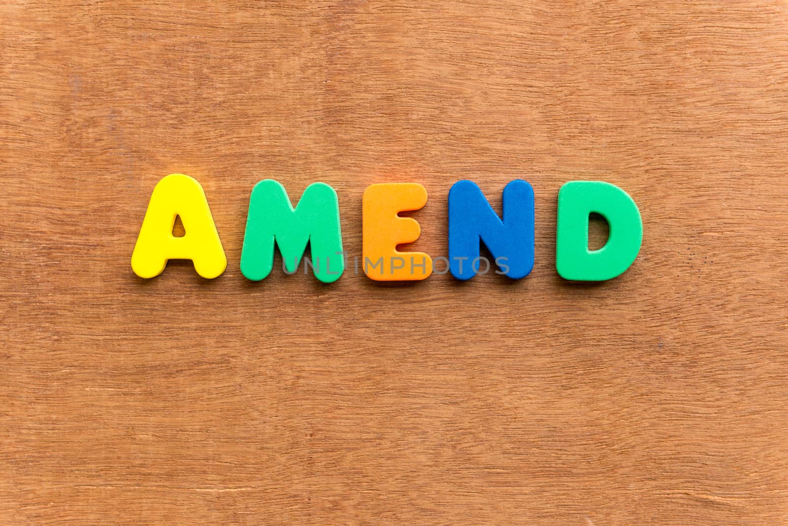 amend colorful word on the wooden background