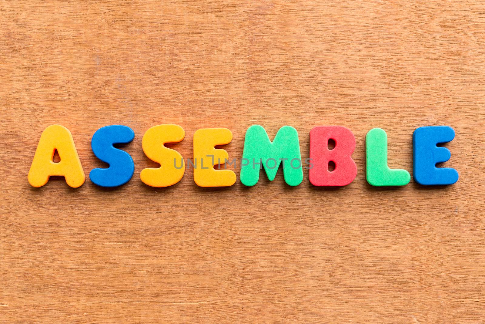 assemble colorful word on the wooden background