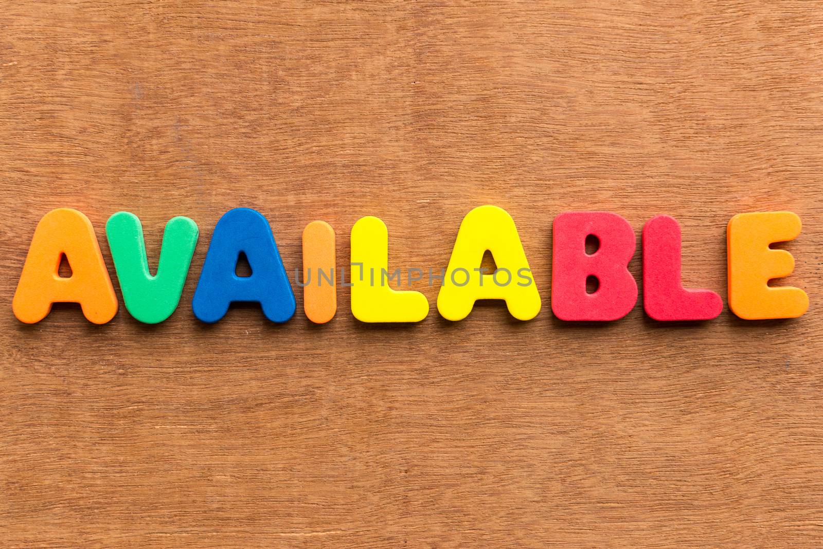 available colorful word on the wooden background