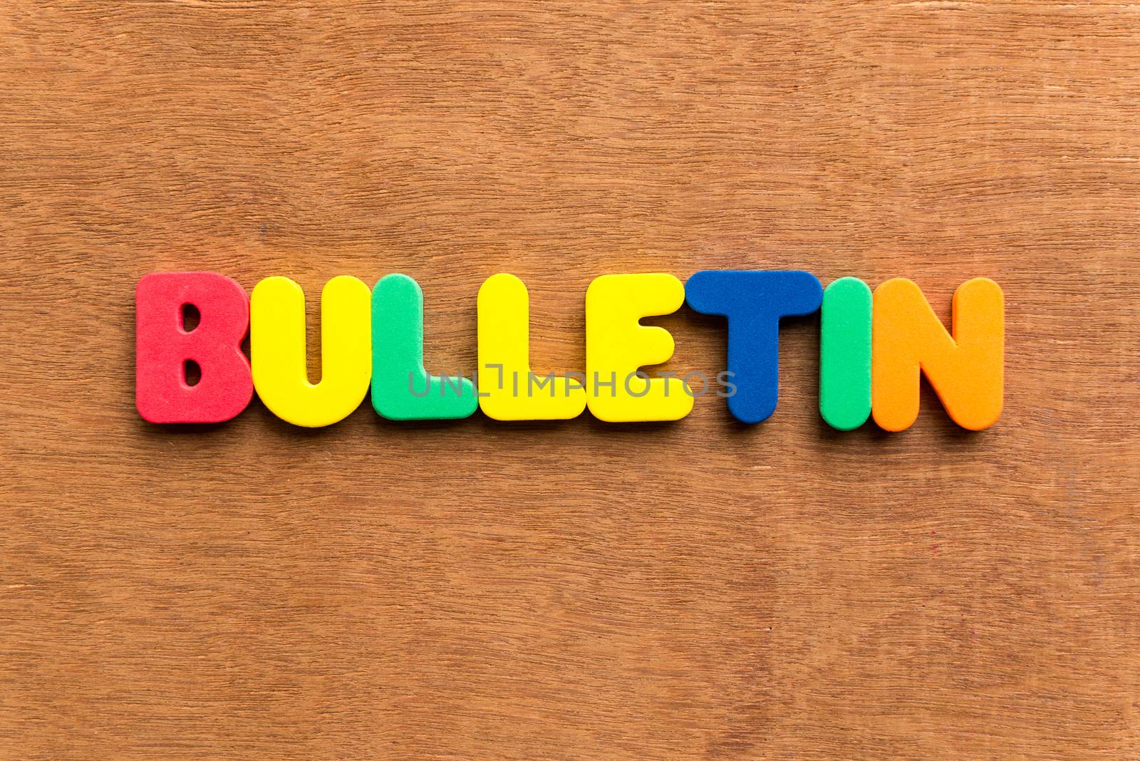 bulletin colorful word on the wooden background