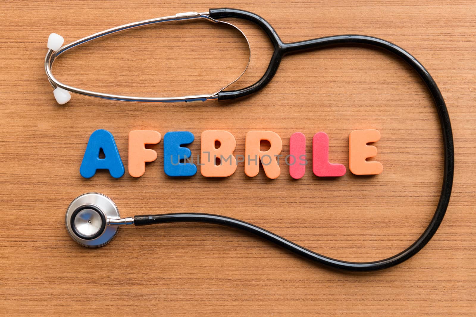 afebrile colorful word on the wooden background