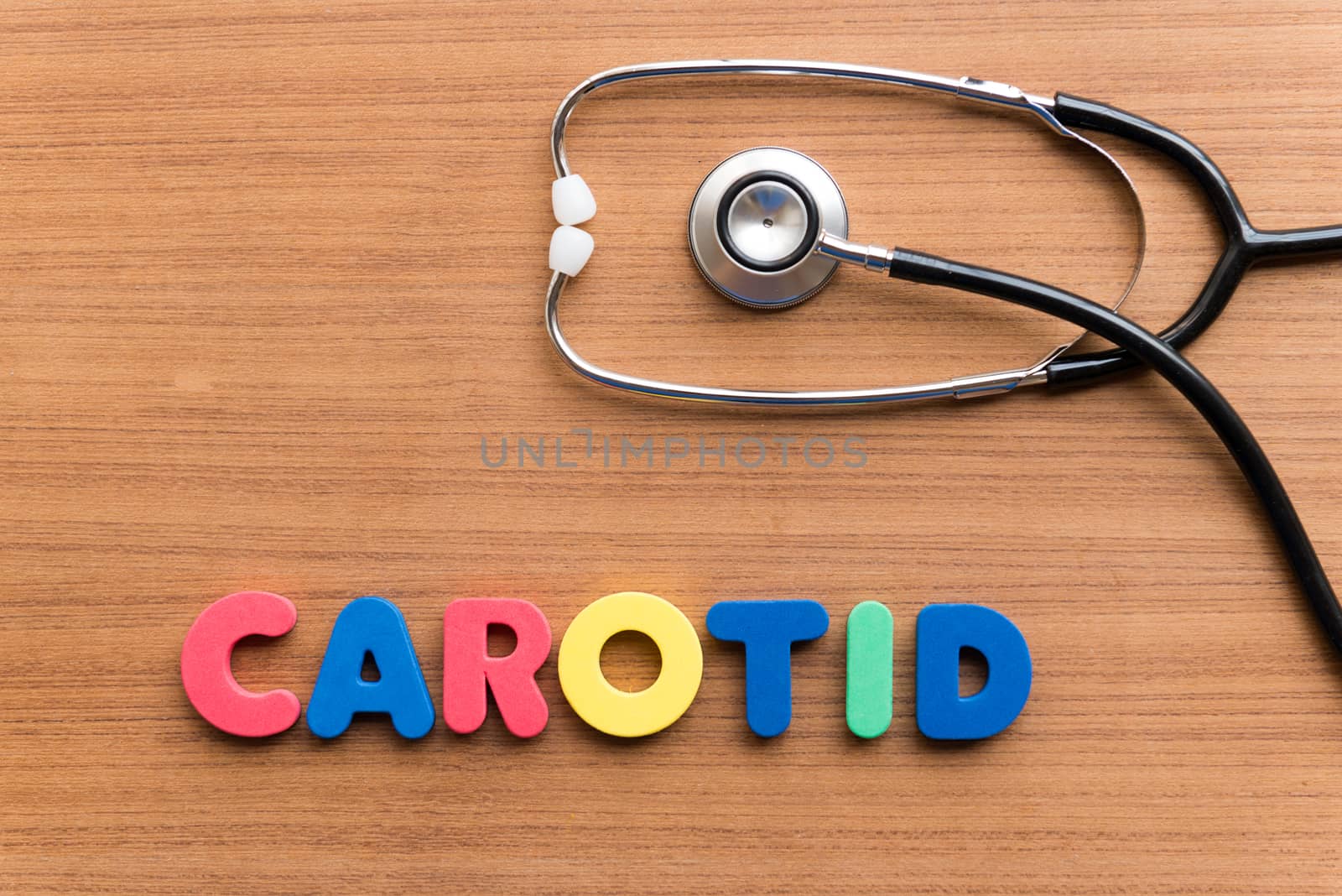 CAROTID colorful word on the wooden background