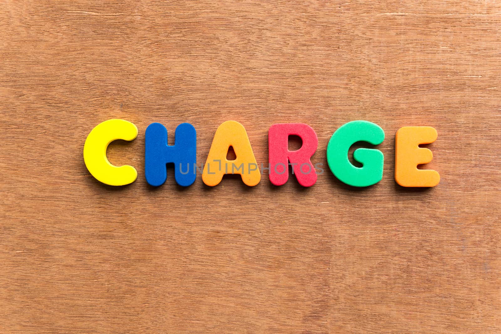 charge colorful word on the wooden background