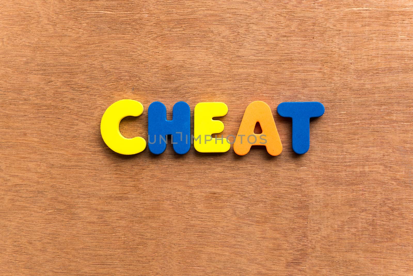 cheat colorful word on the wooden background